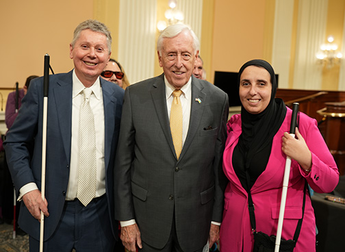 John Par&eacute;, Representative Steny Hoyer (D-MD), and Ronza Othman pose for a photograph.