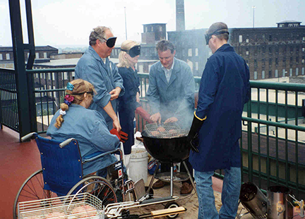 Marc Maurer grilling burgers on the barbeque with NFB members on the deck at NFB headquarters in 2001.