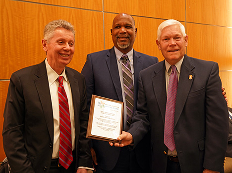 John Par&eacute;, Anil Lewis, and Representative Sessions pose for a photo together. Rep. Sessions holds up his plaque.