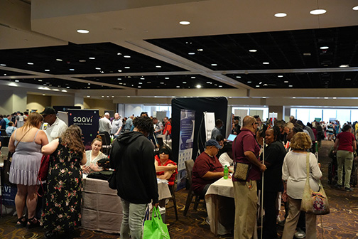 The exhibit hall packed with members.