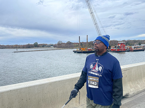 Will Hendrick walks across the Bay Bridge.