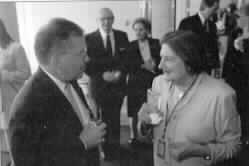 Photo of Terri Colli and Helen Thomas; Lloyd and Mary Jernigan can be seen in the background