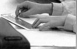Photo of Nikki's hands with 
a slate and stylus.