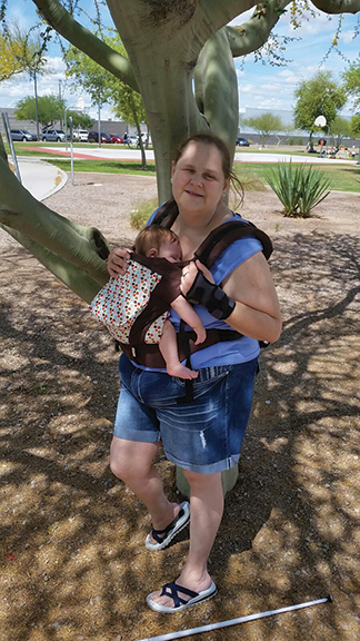 Allison Hilliker finds some shade while out for a stroll.