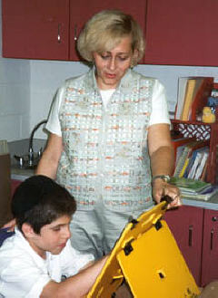 Ben gets a reading lesson from his Braille teacher, Irina Chernyak.