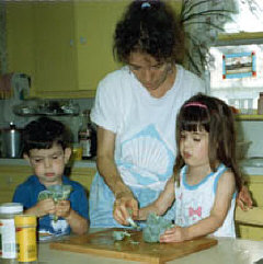 June, 1989 - Carol Castellano in the kitchen with her children, Serena and John.