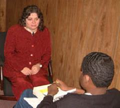 Mildred Rivera discusses college transition topics with Kevin Hatton Jr. during a transition club session.