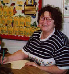 Instructional assistant, Lee Banks, at her desk in Rachel's home room
