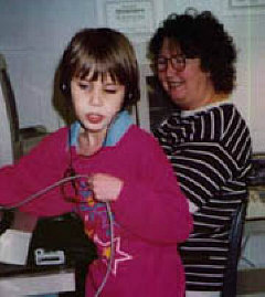 Mrs. Banks stays in the background as Rachel prints out an assignment.