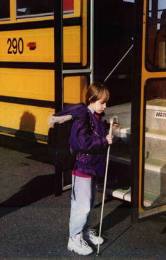 Rachel boards the bus at the end of her school day.