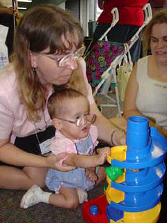 The Discovery Toys exhibit at the convention is a big hit.  In this photo, Ariana Heath and her grandmother, Anita Heath, try out one of the toys.