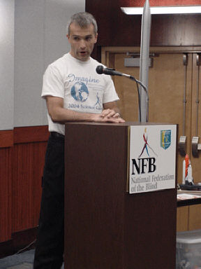 Bernhard Beck-Winchatz speaks to the students at the Rocket On! closing ceremony held in the auditorium of the NFB Jernigan Institute.