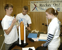 Hoby Wedler examines a rocket model at the 2004 Rocket On! Science Academy.