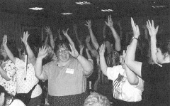 photo of group of parents with their hands in the air. fr99cv42.jpg (18595 bytes)