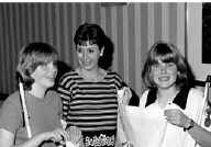 Amanda and April take a break between youth activities at the 2000 convention to talk over old times witht their former teacher of the visually impaired, Cheryl Gateley (center)