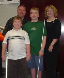Austin and Hunter Hicks with their mother, Jody Hicks, and father, Ron.