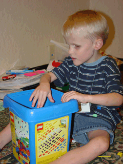 Putting away toys is a valuable skill for all children to learn.