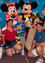 Christopher Nusbaum (center) with his mom and dad, Wendy and Mike, and some of his favorite characters from Disney.