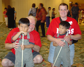 Barbara and David Hammel pose with their four-year-old twins, Jessie and Paul, at the Cane Walk