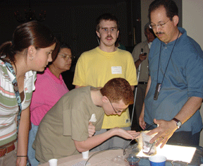 Jimmy Cale leans in close to fully experience the latest chemistry experiment.