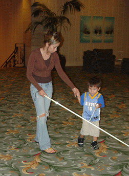 Two beneficiaries of Mr. Cutter�s training, Melissa Fernandez introduces her son Jacob Trevino to the benefits of the white cane.