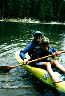 Dad teaches Kyra (age 10) to kayak.
