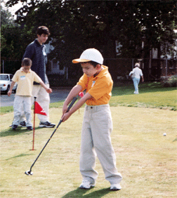 Even at age 6, Patrick Molloy recognizes the importance of a strong golf swing.