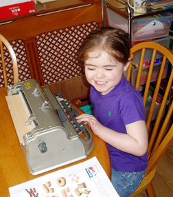 Harmony enjoying the freedom and independence that Braille literacy brings.