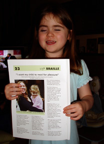Harmony holding the Spring 2006 LOOK magazine which published an article about why she is learning Braille.
