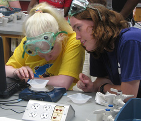 Mentor Heather Oklak (IN) and participant Colleen McBride (NJ), conducting experiments and breaking down barriers at the 2007 Youth Slam.
