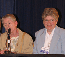 Sister Meg (right) sits on the front platform with chairperson Sharon Maneki as she is presented with the Distinguished Educator of Blind Children Award.