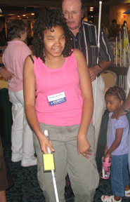 Brianna McDowell, age 12, (Georgia), tests one of the display canes before deciding on a purchase.