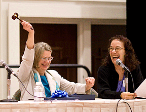 Barbara (left) shows off her new rosewood gavel to the delight of Carol (right) and the audience. Photo courtesy of Bobby Cunningham