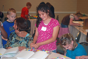Ixcel Larrauri (VA) (standing) and other children