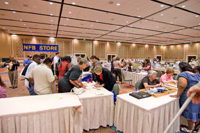 People browse through a range of products in the exhibit hall.