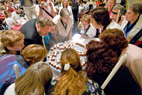 After the candles are lit, the Twig award winners are invited to step up and help blow them out.