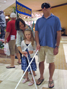 Doug Popper (CA) and his daughter, Rio, explore the hotel with their canes.