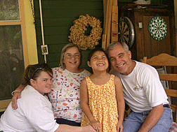 Merry-Noel Chamberlain and her husband Marty with their two daughters, Royene Douglas (far left) and Ashleah.