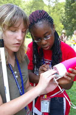 Macy McClain (OH) and Portia Price (MD) do a last minute rocket check before launch.