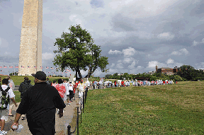 NFB Youth Slam participants walk past the Washington Monument during the Youth March for Independence.