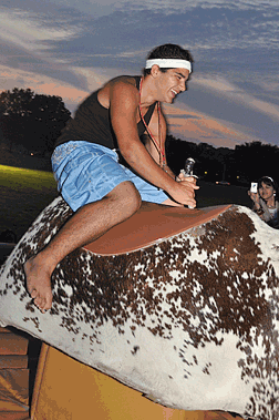 Anthony Ferraro, NJ, rides the mechanical bull during Rec-EX night.