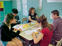 These middle school students from Carey, North Carolina, use their newly acquired Braille skills to emboss UNO cards with Braille as a service project. They learned their skills through the Braille Is Beautiful program.