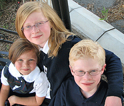 Megan, age 12 (center), with her little sister, Lauren (age 6), and brother, Adam (age 10).