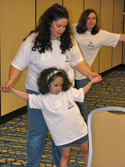 Stephanie Kieszak-Holloway and her daughter Kendra practice yoga together.