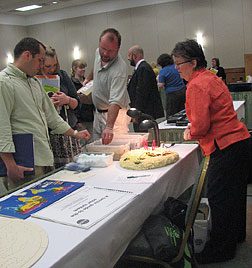 Dinah Little shows tactile representations of the planets to families at �Beginnings and Blueprints.�