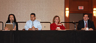 Seated at the head table at the seminar for parents and professionals (left to right) are NOPBC President Carol Castellano; Dr. Edward Bell, director of the Professional Development and Research Institute on Blindness at Louisiana Tech University; and Melody Lindsey, president of the National Association of Blind Rehabilitation Professionals.