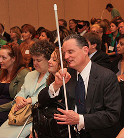 Marc and Pat Maurer sit in the front row at the seminar with their daughter, Dianna.