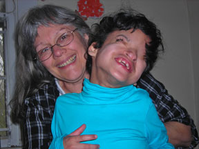 Makaily snuggles on her mother's lap as she and her mom enjoy a good laugh together.