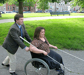 Sometimes Treva lets her husband, Tony, "drive." She holds his cane for him and detects travel paths and obstacles with her own cane.