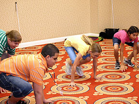Children in Youth Camp practice frog jumps
